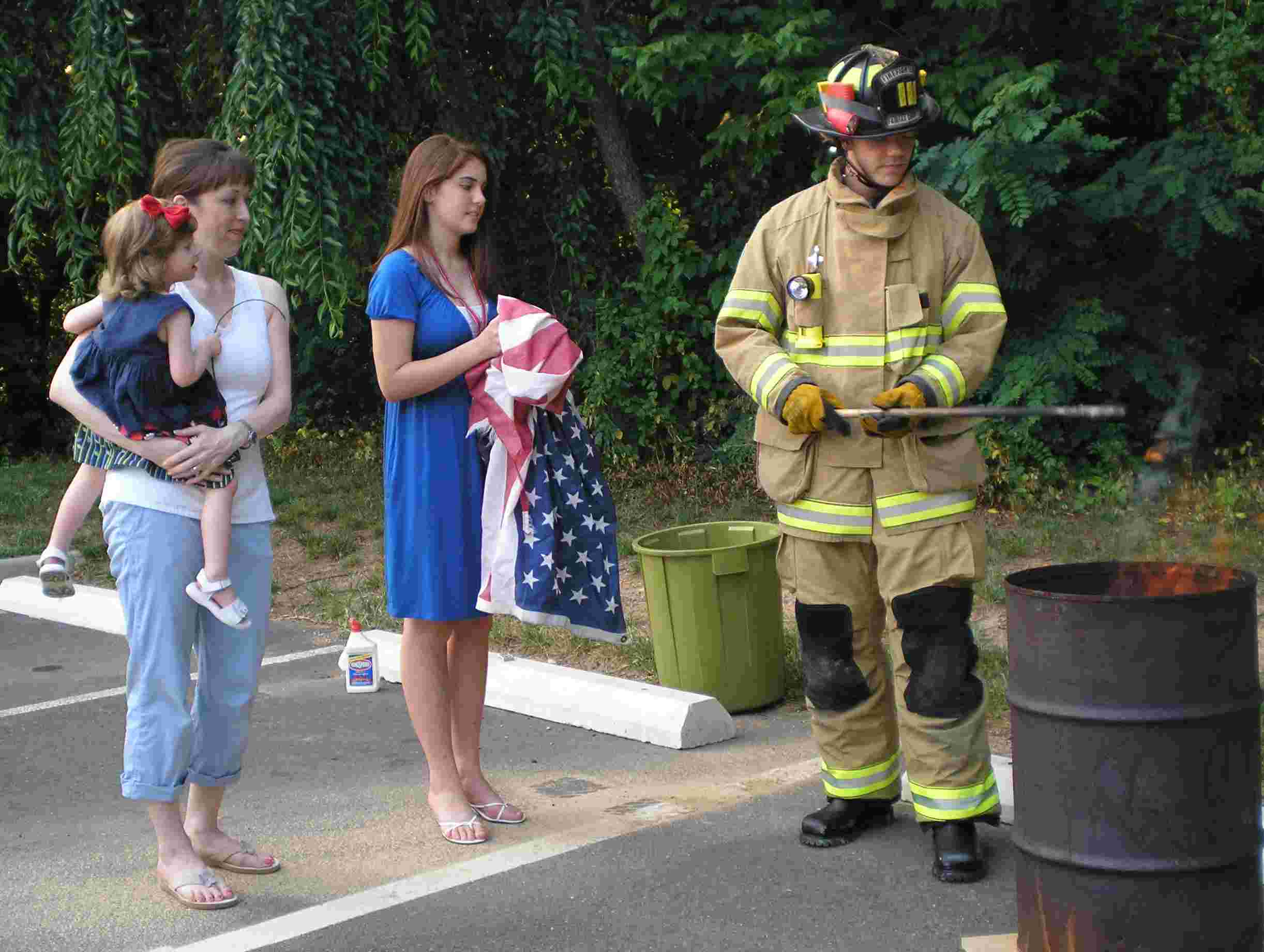 Participants retire worn flags.
