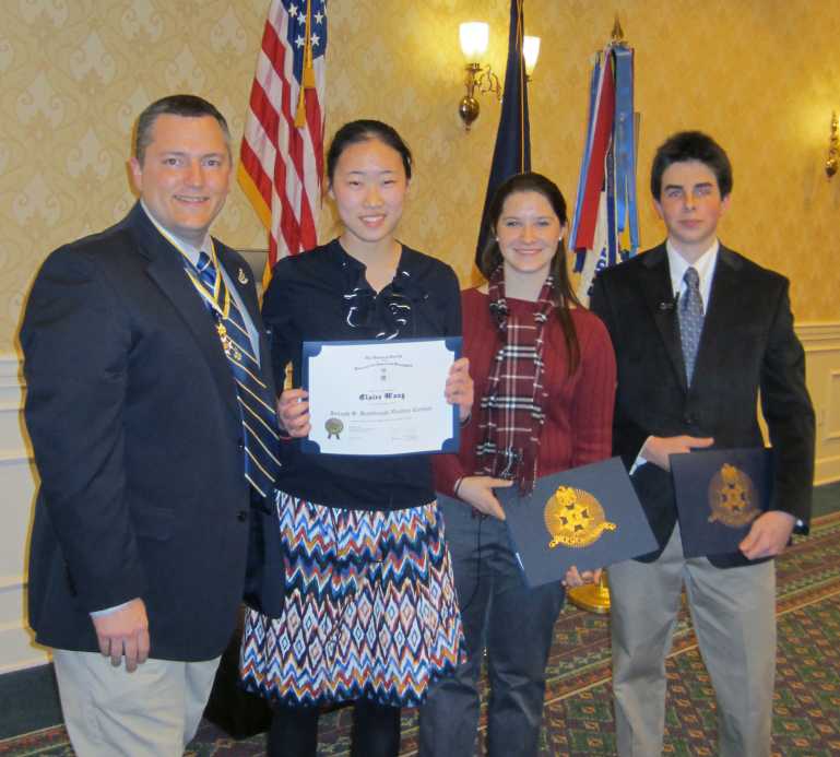 President Dan with left, Clare Wang, Trinity Christian School; runner up Annmarie Baxter, and third place Forbes McKay, Bishop O�Connell High School.