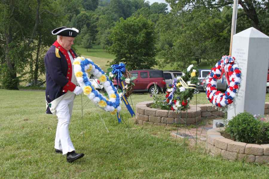 Larry McKinley presents a wreath for the Fairfax Resolves.