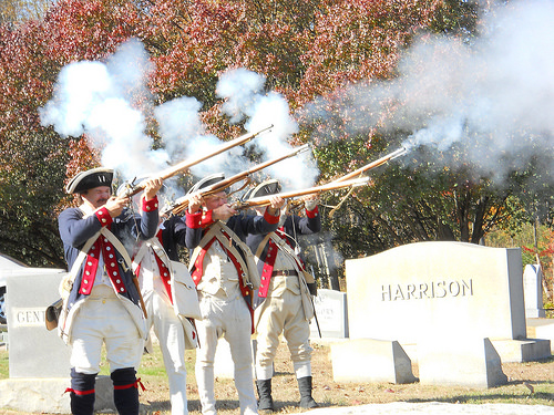 Members of VASSAR Color Guard fire a salute